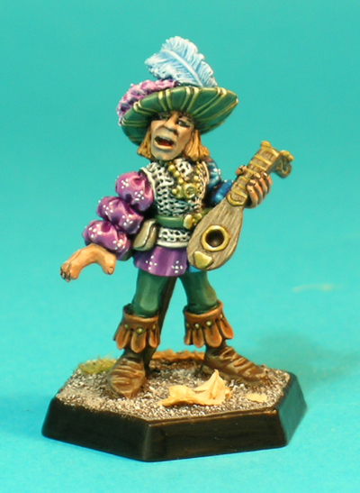 Pose 1, variant A. The foot version of this figure wears a chainmail vest over his fancy puff-sleeved shirt. He sports an extravagant feathered hat, and wears a slim-bladed sword at his belt. He is depicted strumming on his lute and singing.