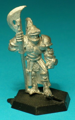 Pose 1. This figure wears a suit of full plate armour, a long surcoat, and a plumed great helm with visor. He holds a poleaxe with a wickedly curved axe-blade and has a shield stud on his left hand.