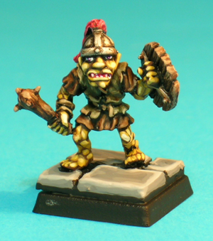 Pose 3, variant A. This figure wears a ragged sleeveless leather jerkin, and holds a short, studded wooden club in his right hand. He appears to be stepping tentatively forward to attack. This variant wears a crossbanded conical steel helmet with a horse-hair plume, and he is looking straight forwards. His partly open mouth has upper fangs barely visible.