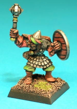 Pose 1, variant B. This variant wields a mace made of a ball with four studded bands. He wears a fluted conical helmet with a twisted cloth band around the edge and a chainmail neck-guard. His head looks to his right, with a grimacing, slightly open mouth.