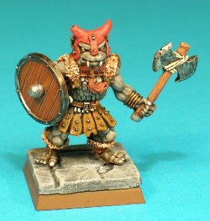 Pose 1, variant B. This variant wears a studded leather hat with horn-like protrusions and short earflaps and nasal, and his axe has a notched double blade secured by string. He has a dog-like face with a short muzzle, and a closed mouth with upper fangs protruding. he is looking forwards, and has no earrings. Pose 1, variant B. This variant wears a studded leather hat with horn-like protrusions and short earflaps and nasal, and his axe has a notched double blade secured by string. He has a dog-like face with a short muzzle, and a closed mouth with upper fangs protruding. he is looking forwards, and has no earrings.