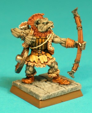 Pose 2, variant B. This variant is bare-headed and has a tall mohican-style haircut. He has a dog-like face with a short muzzle, and a snarling mouth revealing upper fangs and a set of teeth. His head looks along the line of his bow. He has 3 plain earrings in his right ear and 2 in his left. Pose 2, variant B. This variant is bare-headed and has a tall mohican-style haircut. He has a dog-like face with a short muzzle, and a snarling mouth revealing upper fangs and a set of teeth. His head looks along the line of his bow. He has 3 plain earrings in his right ear and 2 in his left.