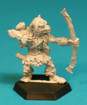 Pose 2, variant C. This variant wears a tatty leather hat with long cheekflaps and a scalloped neck. He has a dog-like face with a short muzzle, and a partly-open mouth revealing upper fangs and a set of teeth. His head is level and he looks along the line of his bow. He has no visible earrings Pose 2, variant C. This variant wears a tatty leather hat with long cheekflaps and a scalloped neck. He has a dog-like face with a short muzzle, and a partly-open mouth revealing upper fangs and a set of teeth. His head is level and he looks along the line of his bow. He has no visible earrings