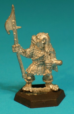 Pose 3, variant E. This variant wears a tatty leather cap with studs and long cheekflaps. His polearm is a glaive-guisarme, with a hooked blade on the far side and a short spike on the nearside. The Gnoll has a broad dog-like face with a short muzzle, and a closed mouth with protruding upper fangs. His head is slightly raised and he looks over his right shoulder. He has no earrings. Pose 3, variant E. This variant wears a tatty leather cap with studs and long cheekflaps. His polearm is a glaive-guisarme, with a hooked blade on the far side and a short spike on the nearside. The Gnoll has a broad dog-like face with a short muzzle, and a closed mouth with protruding upper fangs. His head is slightly raised and he looks over his right shoulder. He has no earrings.
