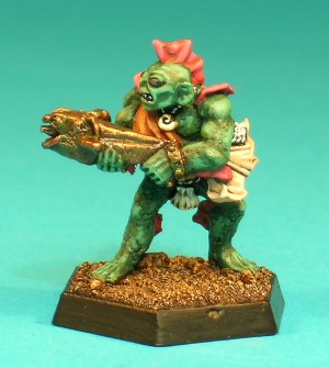 Pose 1, variant A. This Sahuagin is armed with a crossbow, made in the likeness of a large fish. He wears a loincloth made of a chain and a shell, and a bandolier over his shoulder supports a quiver for his crossbow bolts. He wears studded metal bracelets and a shell-shaped medallion. This particular variant has a wide, squat head, with rounded, protruding ears and a 4-spined fin on the back of his head. He has small, round eyes and his mouth is open in a downturned grimace. His head looks along the line of his crossbow. Pose 1, variant A. This Sahuagin is armed with a crossbow, made in the likeness of a large fish. He wears a loincloth made of a chain and a shell, and a bandolier over his shoulder supports a quiver for his crossbow bolts. He wears studded metal bracelets and a shell-shaped medallion. This particular variant has a wide, squat head, with rounded, protruding ears and a 4-spined fin on the back of his head. He has small, round eyes and his mouth is open in a downturned grimace. His head looks along the line of his crossbow.
