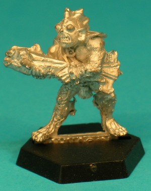 Pose 1, variant B. This variant has a large, round head, with small, pointed ears. He has large, bulging eyes and his wide mouth is partly open showing his teeth, and a 3-spined fin running down the back of his head. He is looking to the left of the line of his crossbow. Pose 1, variant B. This variant has a large, round head, with small, pointed ears. He has large, bulging eyes and his wide mouth is partly open showing his teeth, and a 3-spined fin running down the back of his head. He is looking to the left of the line of his crossbow.