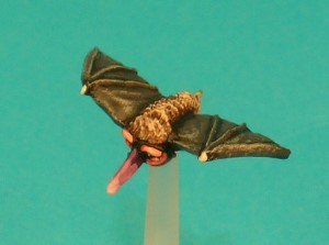Pose 1. This Stirge has long, wide unmarked wings, raised slightly higher than body level. It has a long, straight proboscis, pointing downwards and slightly to the right. Pose 1. This Stirge has long, wide unmarked wings, raised slightly higher than body level. It has a long, straight proboscis, pointing downwards and slightly to the right.