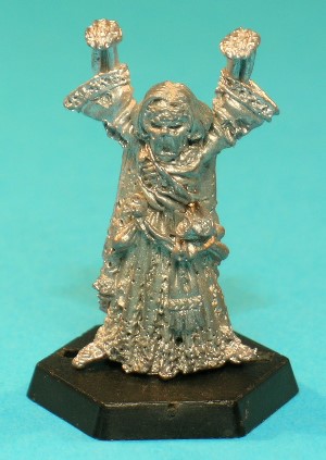 Pose 1, variant F. This variant has a decomposing, flesh-covered face, and is bare-headed apart from an engraved circlet around his forhead. He has long, straight hair with a centre-parting, his mouth is open as if shouting and he looks straight forwards. Pose 1, variant F. This variant has a decomposing, flesh-covered face, and is bare-headed apart from an engraved circlet around his forhead. He has long, straight hair with a centre-parting, his mouth is open as if shouting and he looks straight forwards.