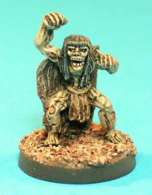 Pose 4, variant A. This figure is a Wight, an evil Undead creature much feared for its level-draining ability. It wears a tattered cloak and a loincloth. This variant has long hair, but with a short fringe. It has a near-skeletal face with its mouth wide open barring its teeth, and looks straight forwards. Pose 4, variant A. This figure is a Wight, an evil Undead creature much feared for its level-draining ability. It wears a tattered cloak and a loincloth. This variant has long hair, but with a short fringe. It has a near-skeletal face with its mouth wide open barring its teeth, and looks straight forwards.